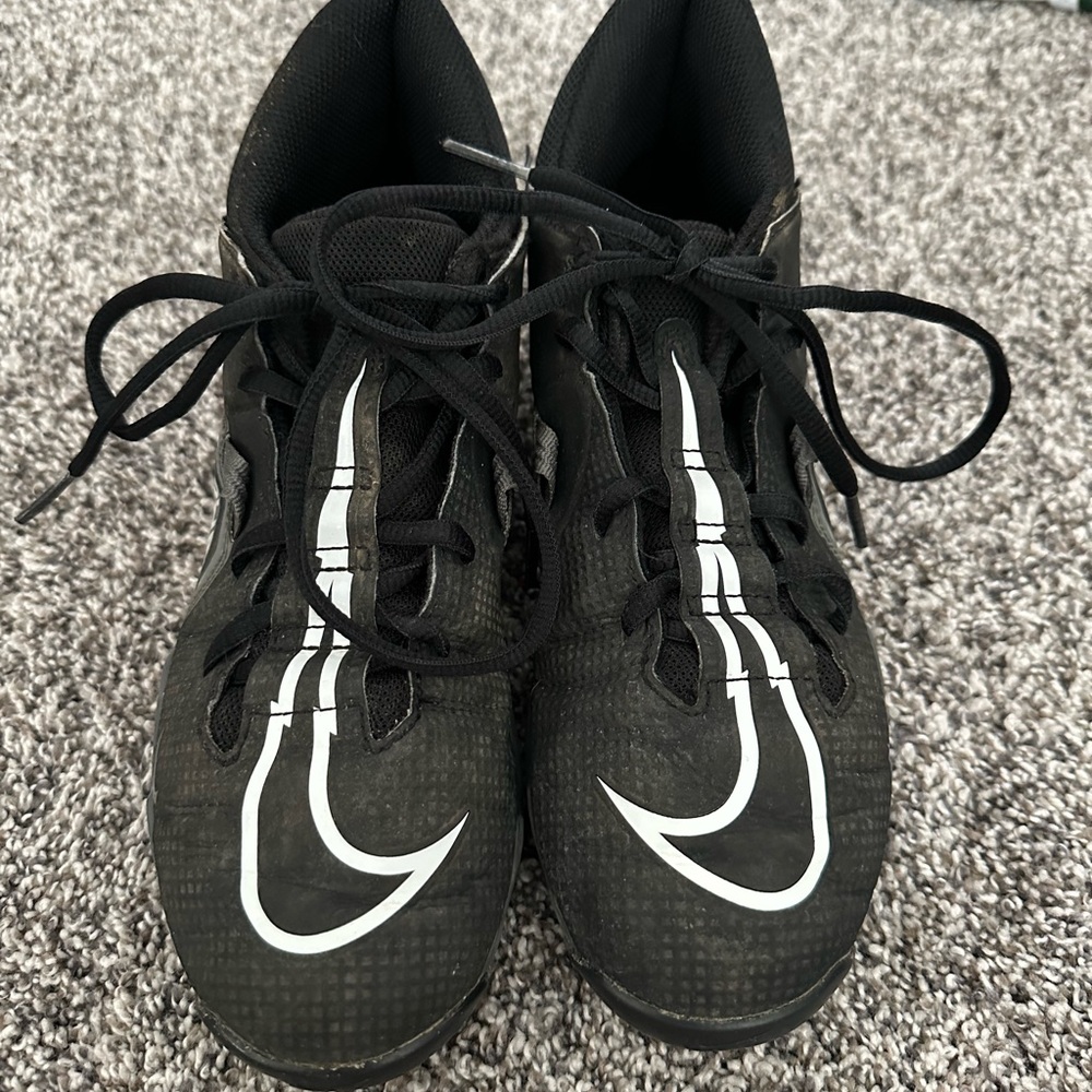 Nike Black Athletic Cleats with White Swoosh Accents